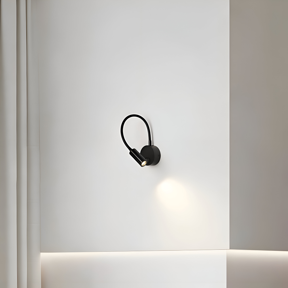 Czarna lampa ścienna LED z regulowanym ramieniem do czytania